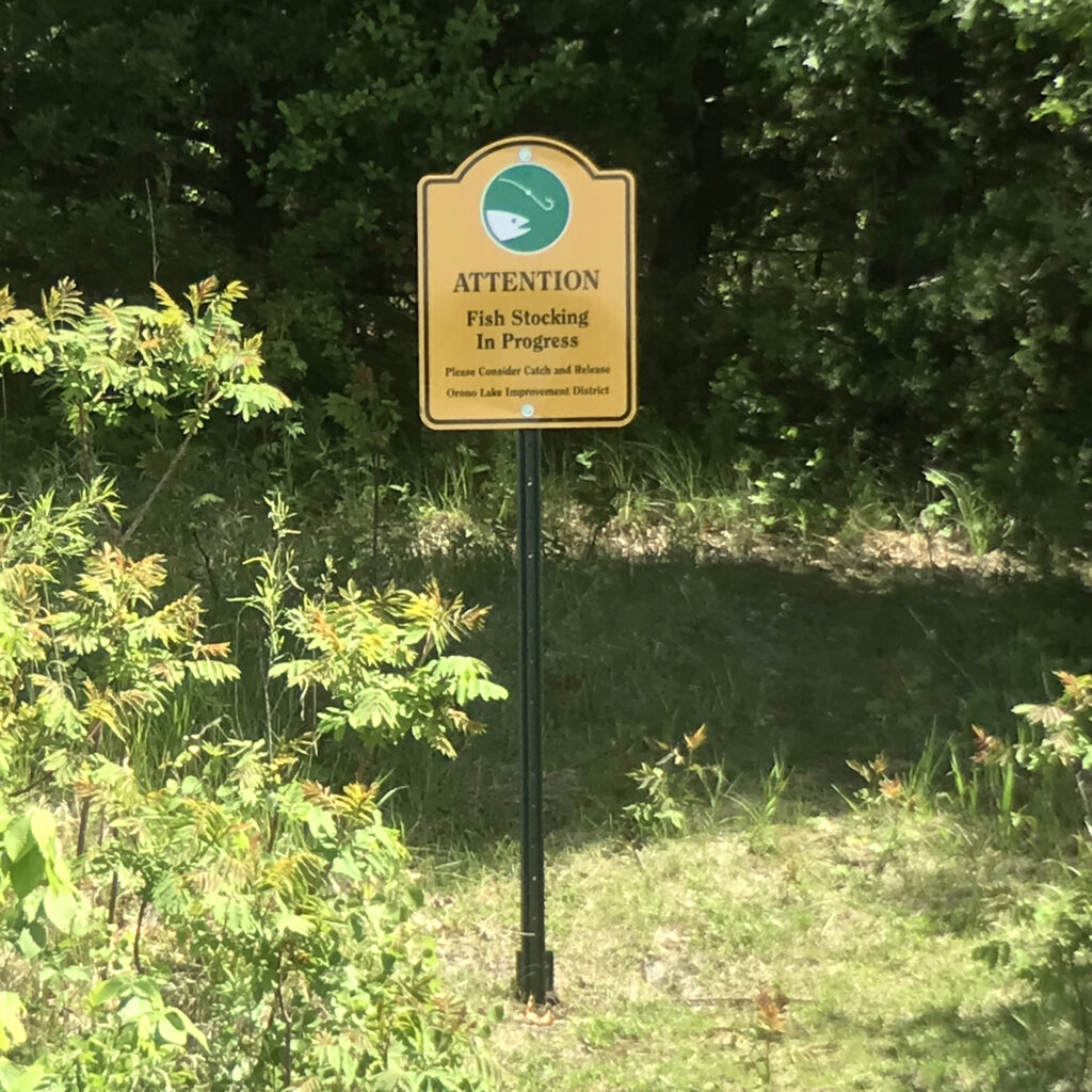 Fish stocking sign on cemetery point